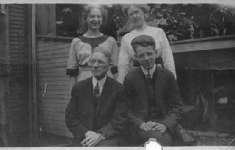 two couples in a backyard